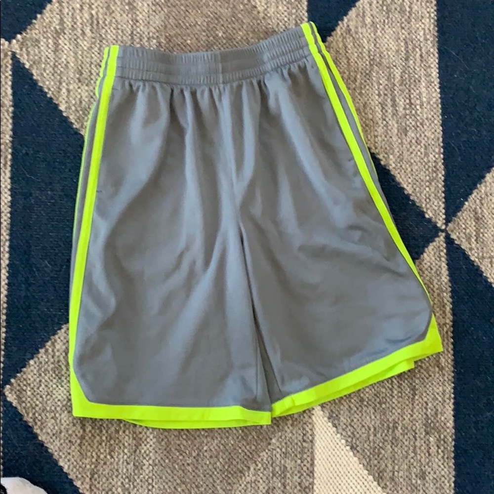 Gray Adidas shorts with lime green.